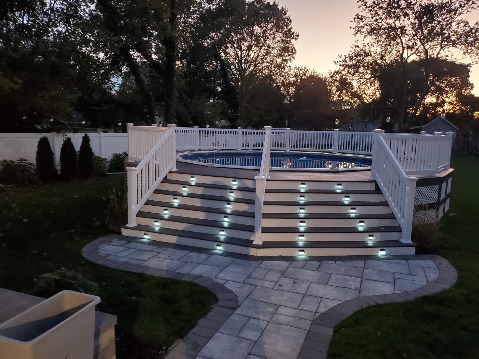 Deck with stairs leading to pool